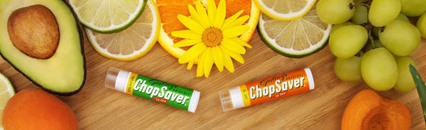 ChopSaver lip balms surrounded by natural ingredients