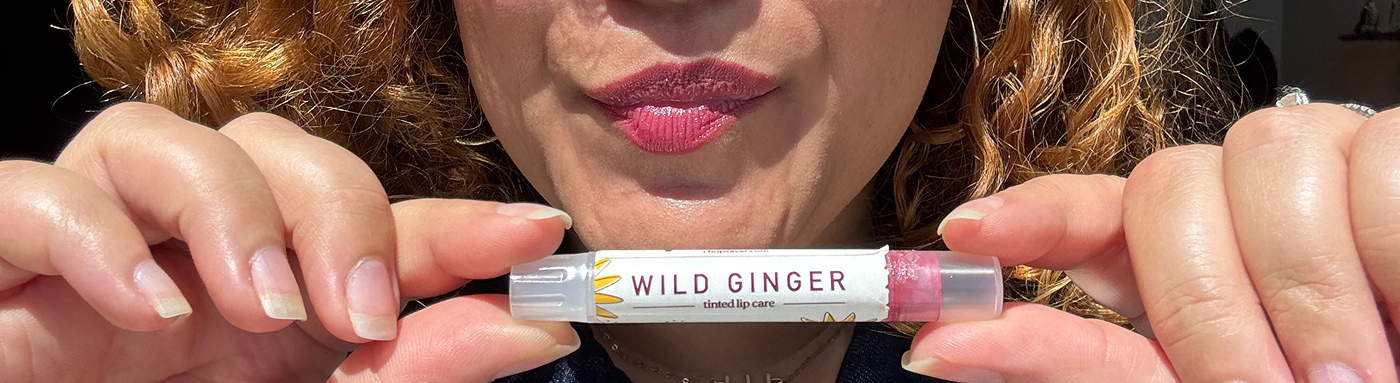 Wild Ginger tinted ChopSaver lip care held near tinted lips